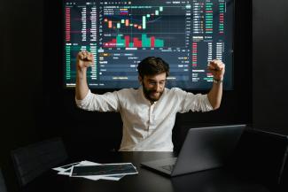 Man infront of stocks